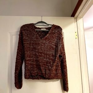 Cute sweater. Worn only a few times. Less than a year old.